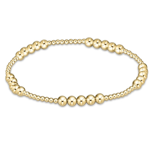 Classic Blissful Pattern bracelet featuring hand-beaded 4mm gold-filled beads with smaller accents on elastic cord.