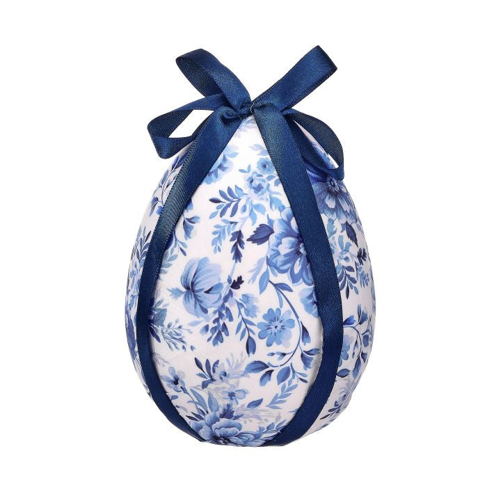 Blue white fabric egg wrapped in traditional toile floral botanical print with a bow.