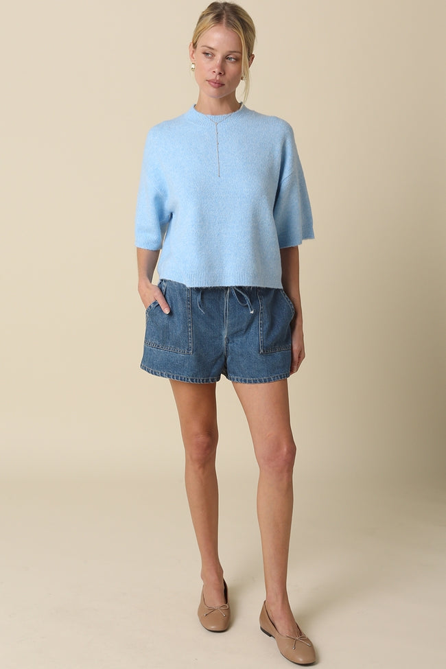 Alice Parker half-sleeve sweater in a soft neutral tone with a relaxed silhouette and crew neckline.
