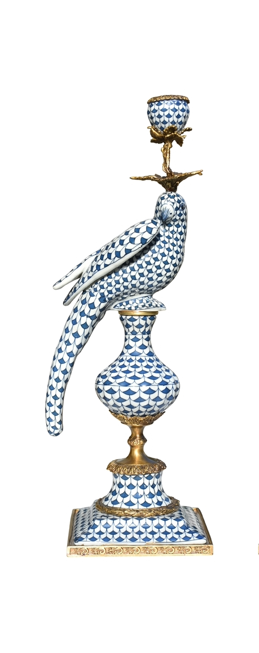 Right-facing bronze bird candlestick with blue and white porcelain fish scale pattern