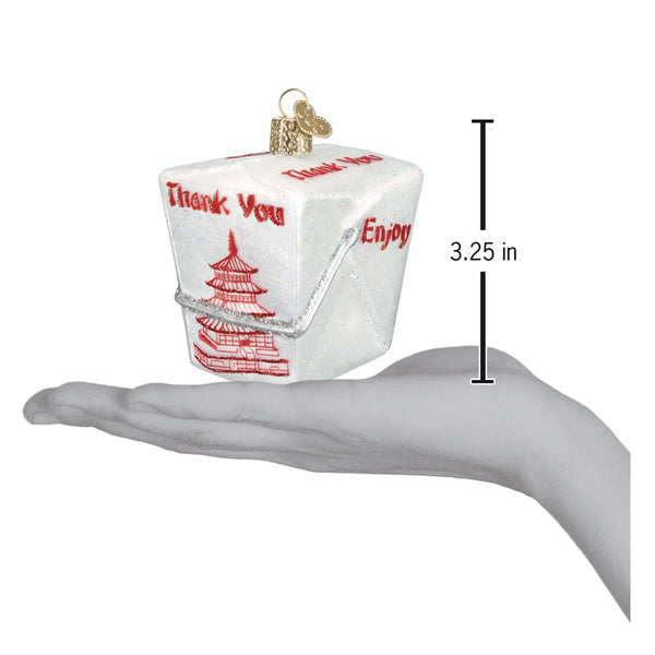 Chinese take-out box glass ornament with red pagoda design, held in a hand for scale.
