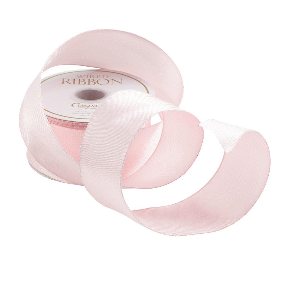 Solid light pink wired ribbon roll with a smooth texture