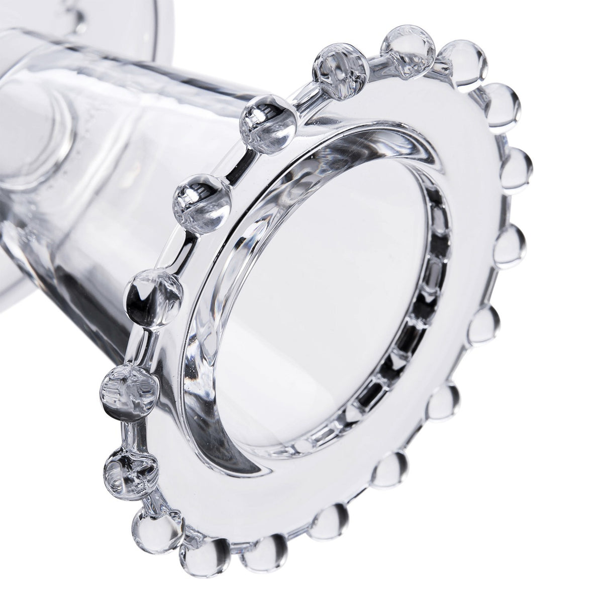 Close-up of the beaded rim on a clear glass dessert bowl.