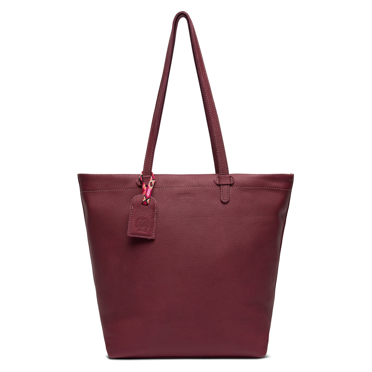 Plum Daily Tote in pebble leather with zipper closure, slide pocket, hook-clip lanyard, and attached hand-woven friendship bracelet bag tag.