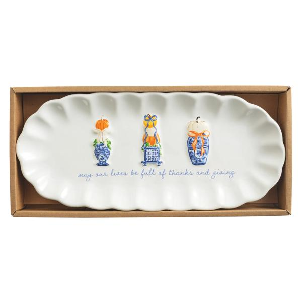 White ceramic Pumpkin Topiary Tray with blue and white ginger jar designs in a cardboard box.