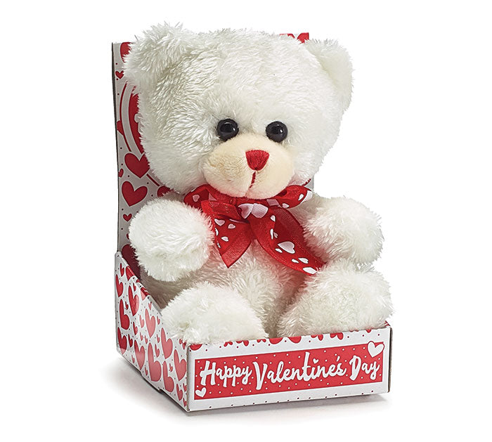 Plush white bear with red accents displayed in a clear box