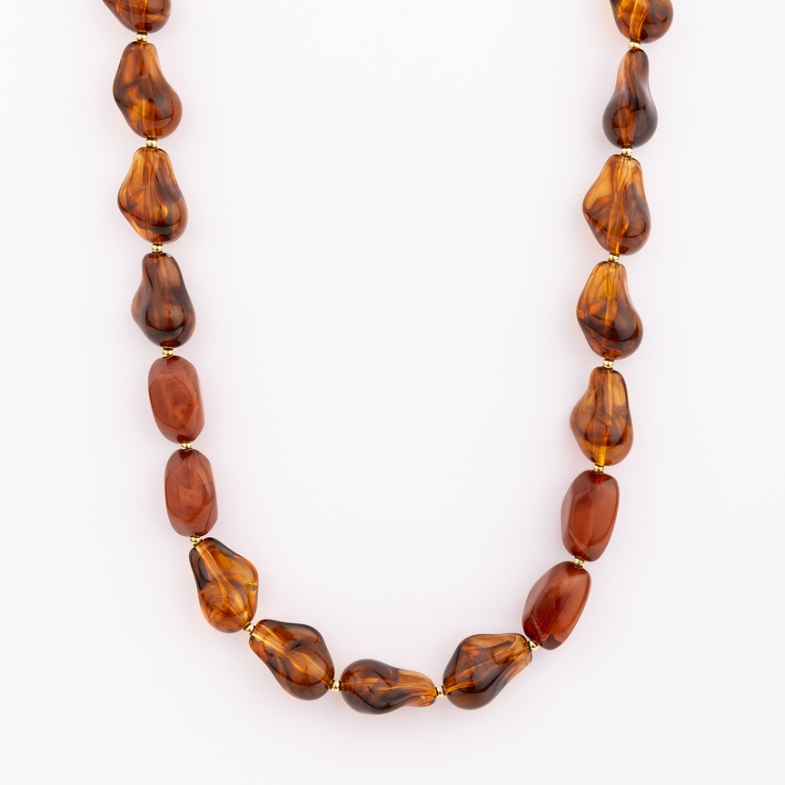 Cami Necklace featuring irregular amber-colored resin beads with gold-tone spacers.