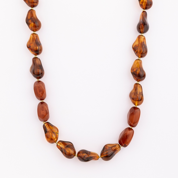 Cami Necklace featuring irregular amber-colored resin beads with gold-tone spacers.