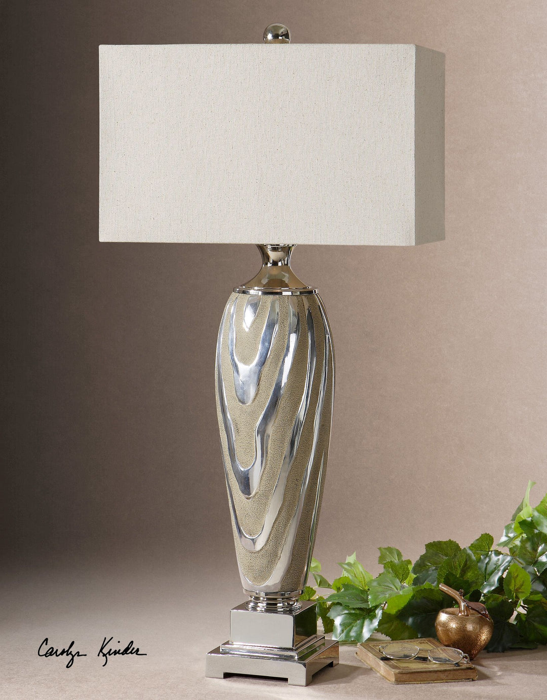 Allegheny table lamp with a textured silver and beige wavy pattern on its base, topped with a rectangular cream shade.