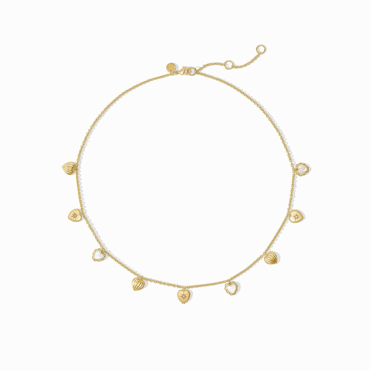 Gold heart charm necklace with mother of pearl and CZ accents on an adjustable chain.