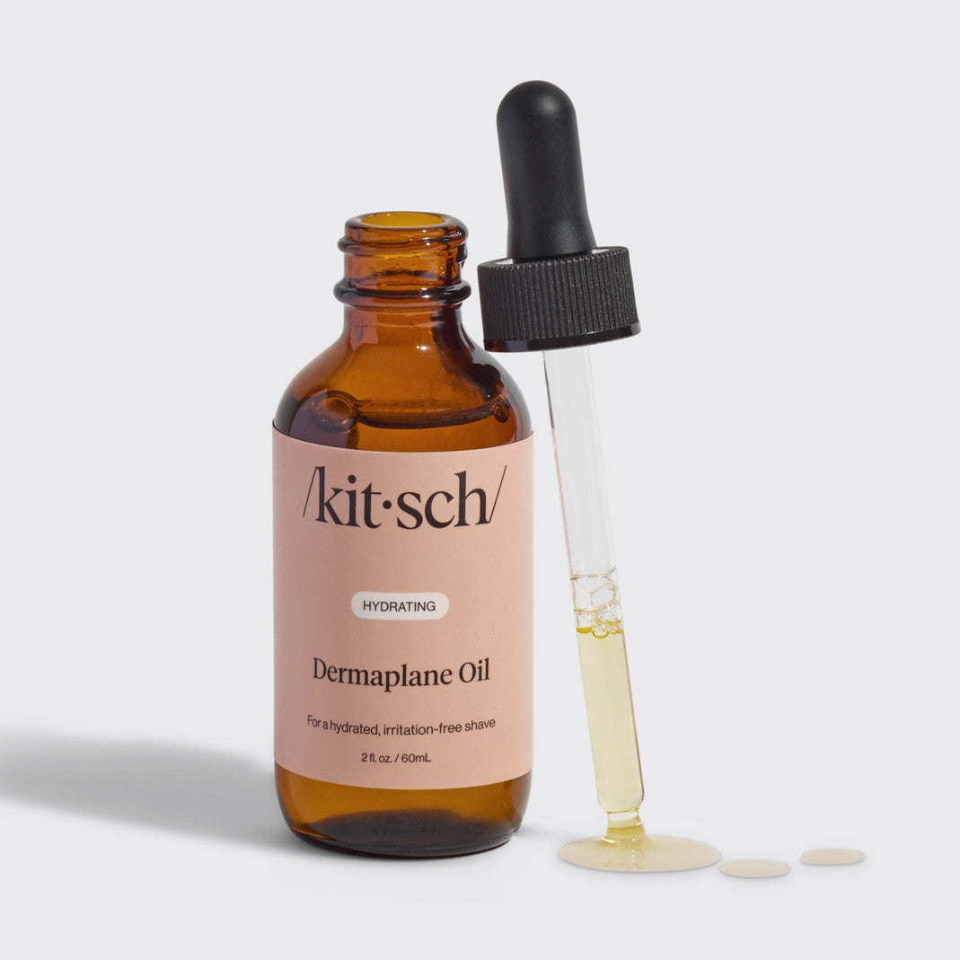 Bottle of Hydrating Dermaplane Oil with a clear liquid inside.