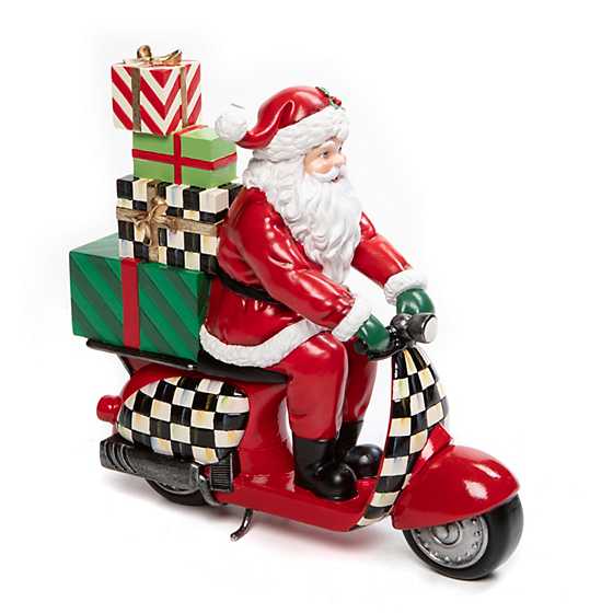 Resin Santa on a scooter figurine with red suit, black hat, white beard, and green background.