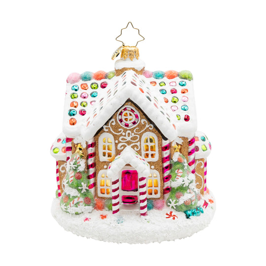 Sweet Treat House gingerbread ornament with snowy icing, candy accents, and two Christmas trees.
