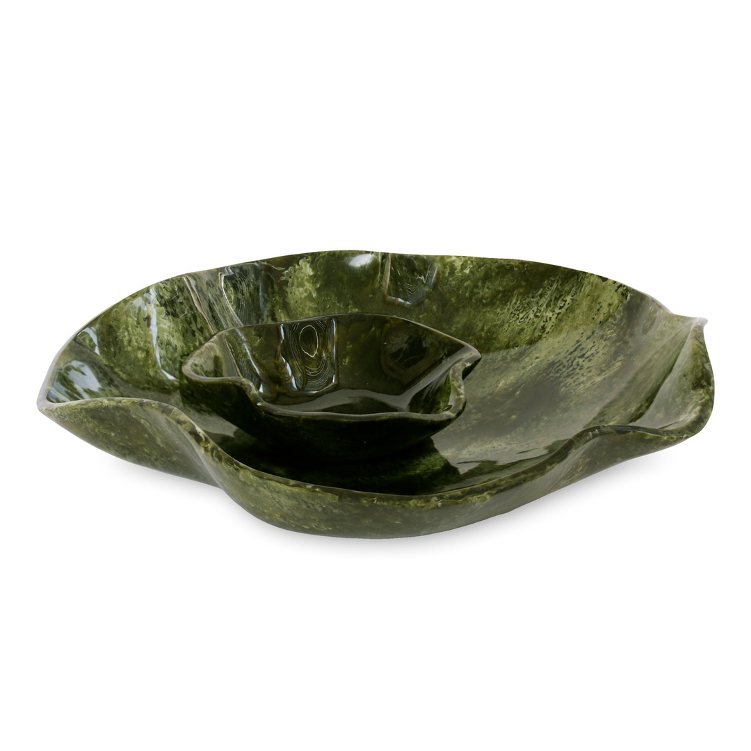 Green swirled resin chip and dip bowl with a built-in center well and wavy edges.