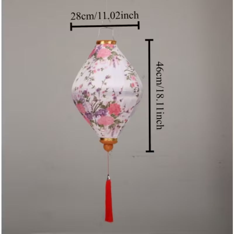 Traditional Chinese silk lantern with red fabric panels featuring gold floral patterns.