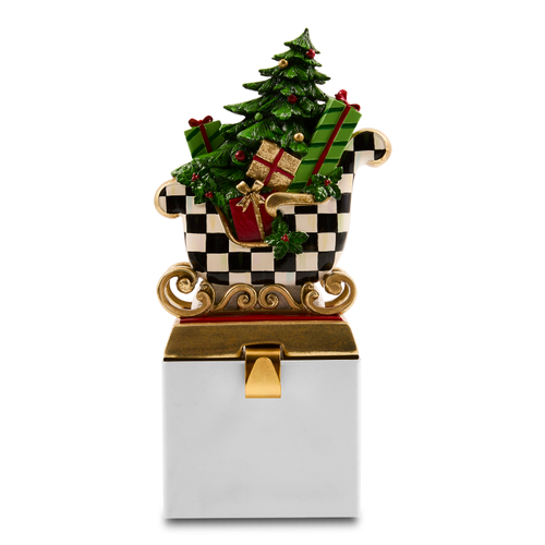 Westminster Sleigh Stocking Holder with a checkered sleigh, Christmas tree, and gifts on a base.
