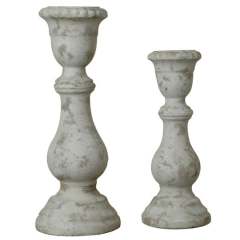 Newport candleholders in black metal with a geometric cutout pattern.