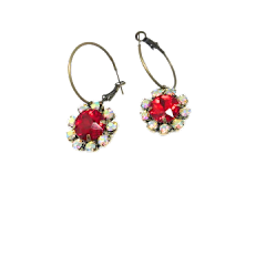 Ruby red flower hoop earrings with iridescent rhinestone petals on a gold-tone metal frame.