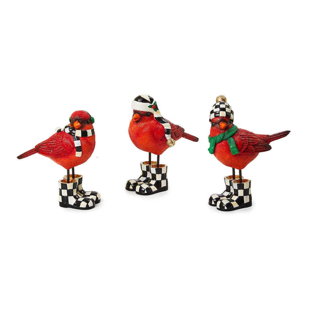 Resin Christmas cardinal ornament with red body, white accents, and gold beak.