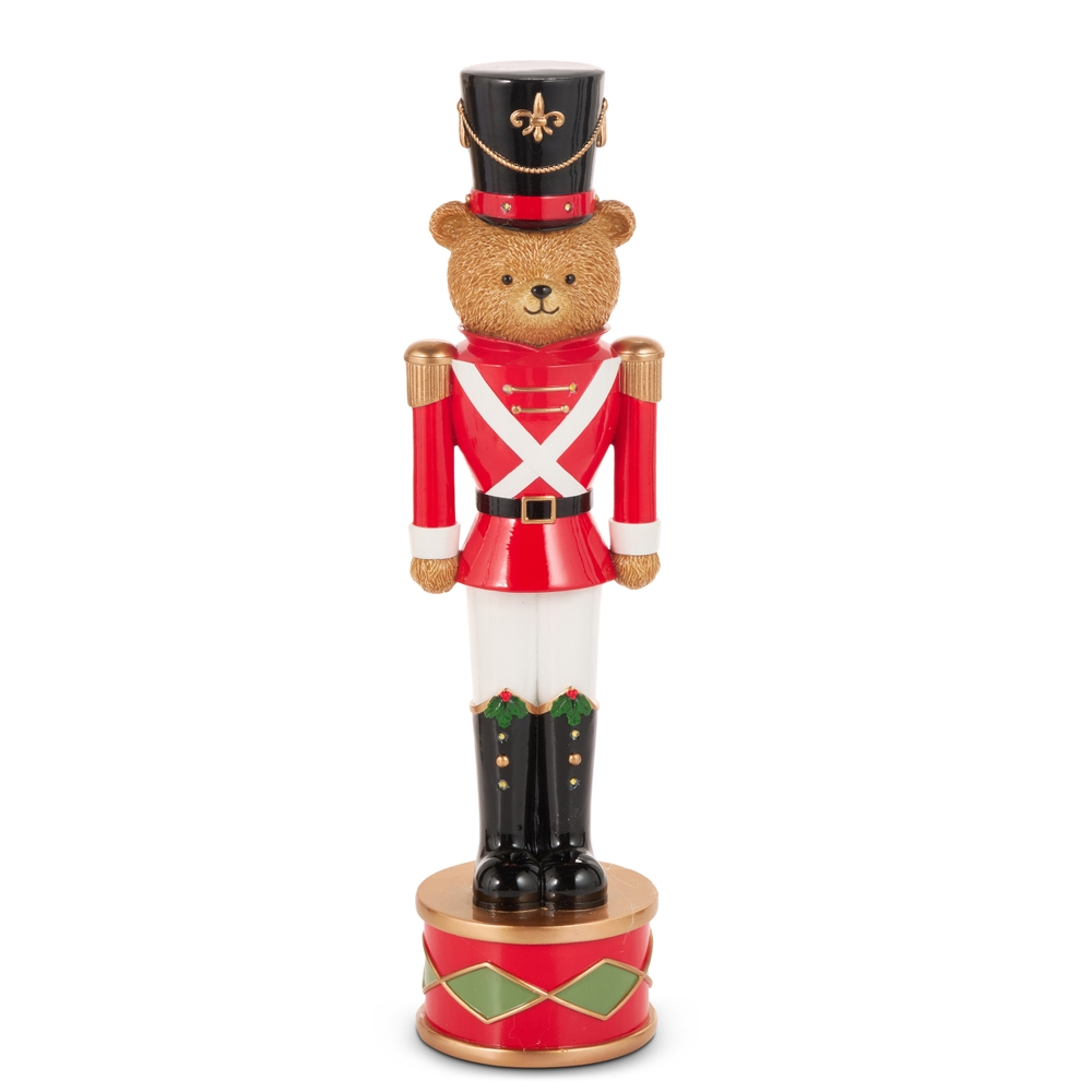 17.75 inch lighted teddy bear nutcracker in a red soldier uniform standing on a drum base.