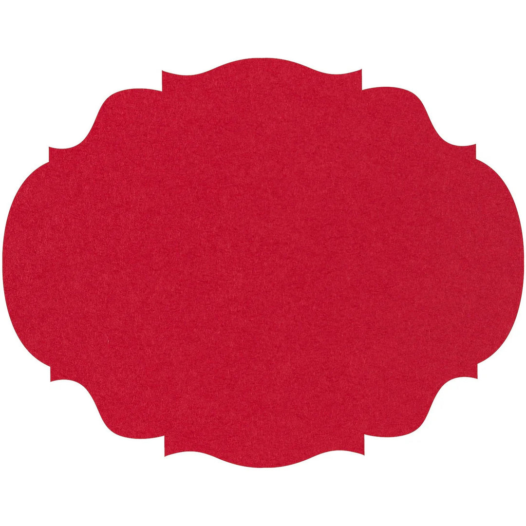 Red die-cut placemat with a decorative scalloped edge and textured finish.