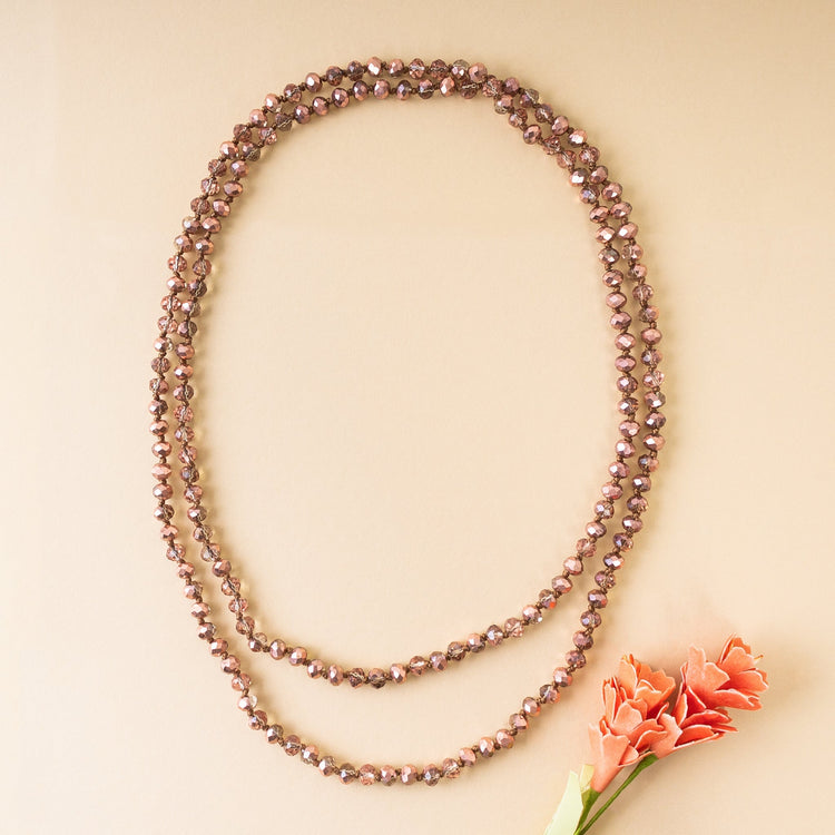 60-inch long necklace featuring clear crystal beads with a simple strand design.