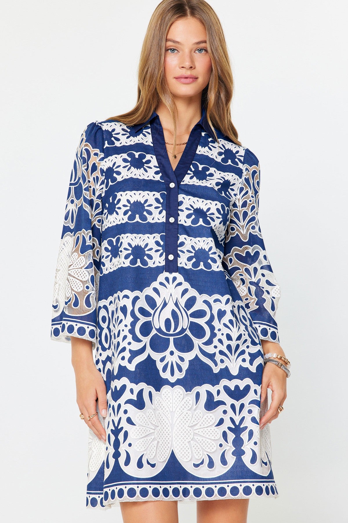 Avery mini dress in beige rayon with floral lace embroidery on a relaxed tunic silhouette.