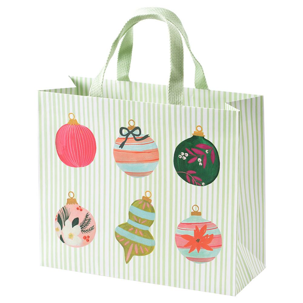 Large horizontal gift bag with cheerful colorful prints on durable paper featuring strong handles.