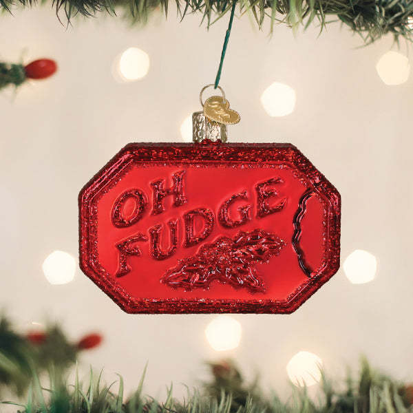 Oh Fudge soap ornament shaped like a chocolate truffle with white drizzle pattern on dark brown material.
