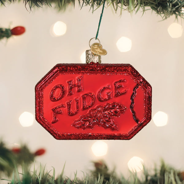 Red glittery glass ornament shaped like a bar of soap with the words "OH FUDGE" embossed on it.