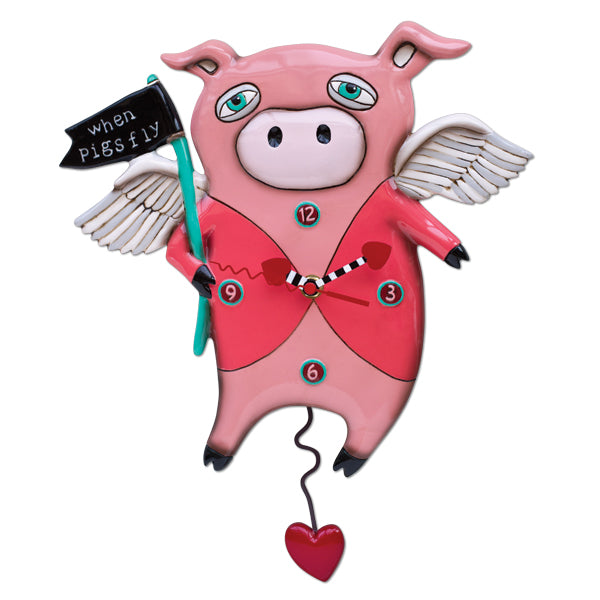 Round wall clock with black frame featuring a pig illustration flying on wings against a white background.