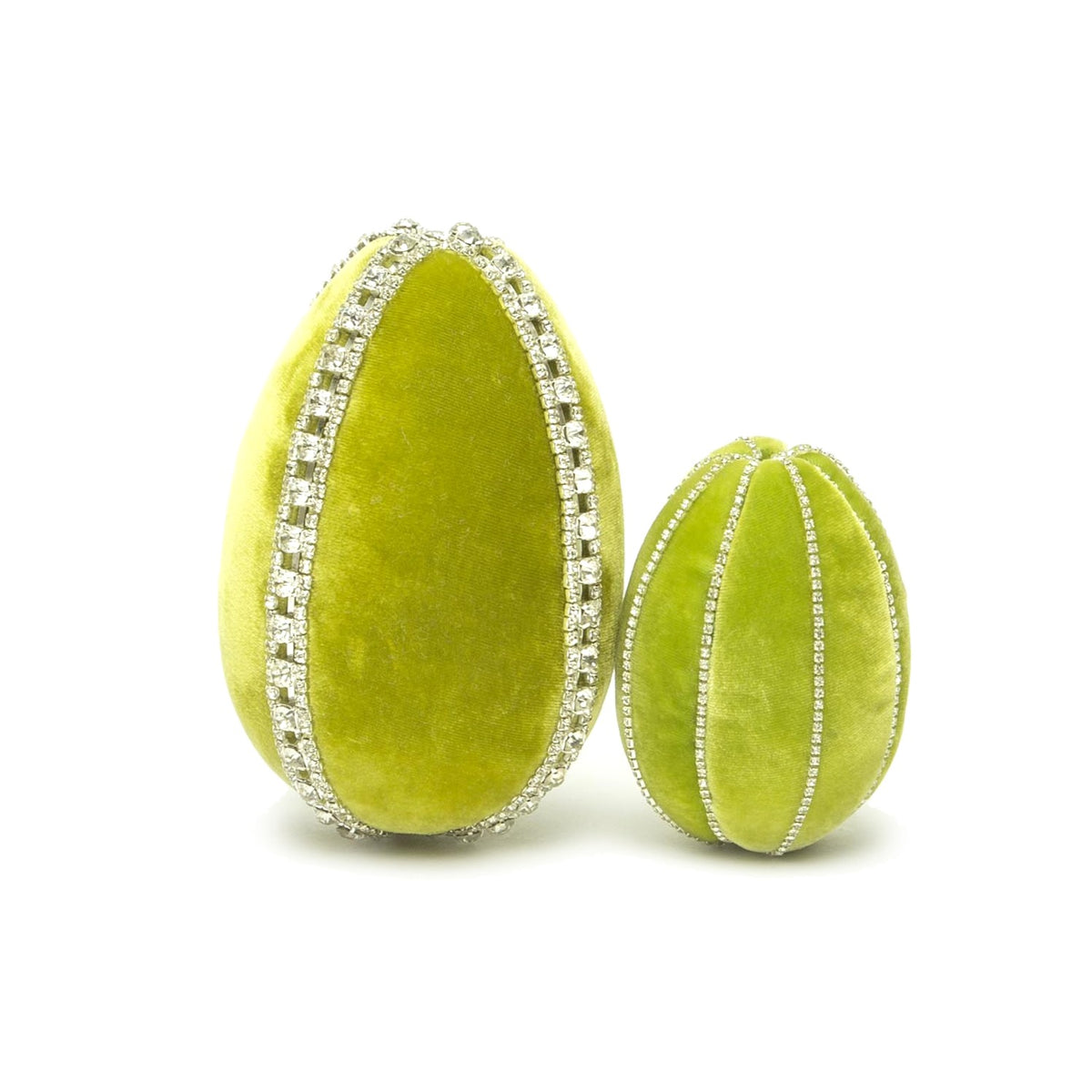 Two lime green velvet eggs decorated with rhinestone trim, one large and one small.