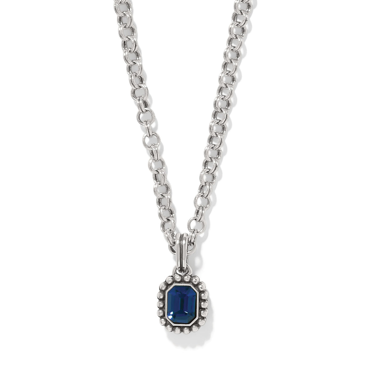 Twinkle Luxe Blue Necklace featuring a silver chain and an emerald-cut blue gemstone pendant.