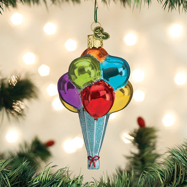 Glass Christmas ornament shaped like a bunch of colorful balloons tied with a red bow.