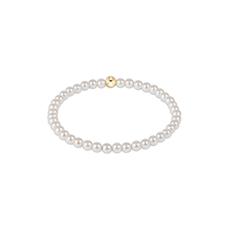 Classic Pearl 4mm Bead Bracelet featuring white crystal pearls and a single gold accent bead.