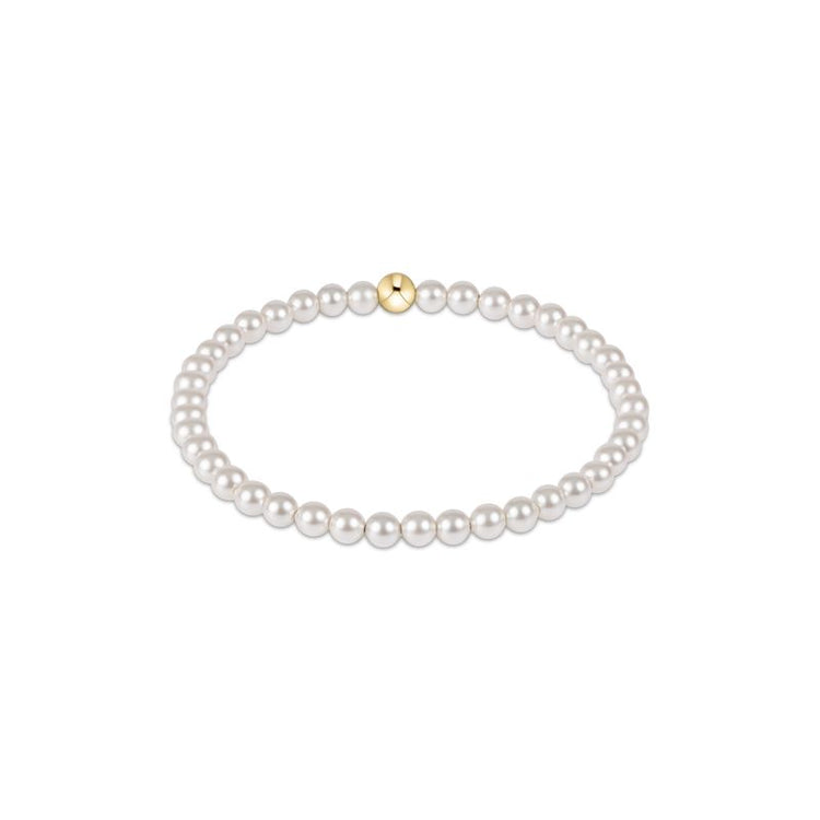 Classic Pearl 4mm Bead Bracelet featuring white crystal pearls and a single gold accent bead.