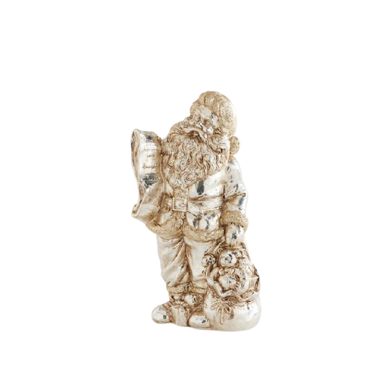 Vintage silver-toned Santa figurine holding a list and a sack of toys.