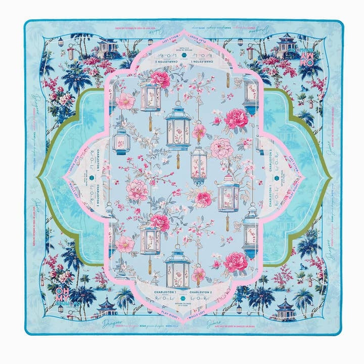 Light blue yoga mat with a floral and lantern pattern, featuring pink and green accents.