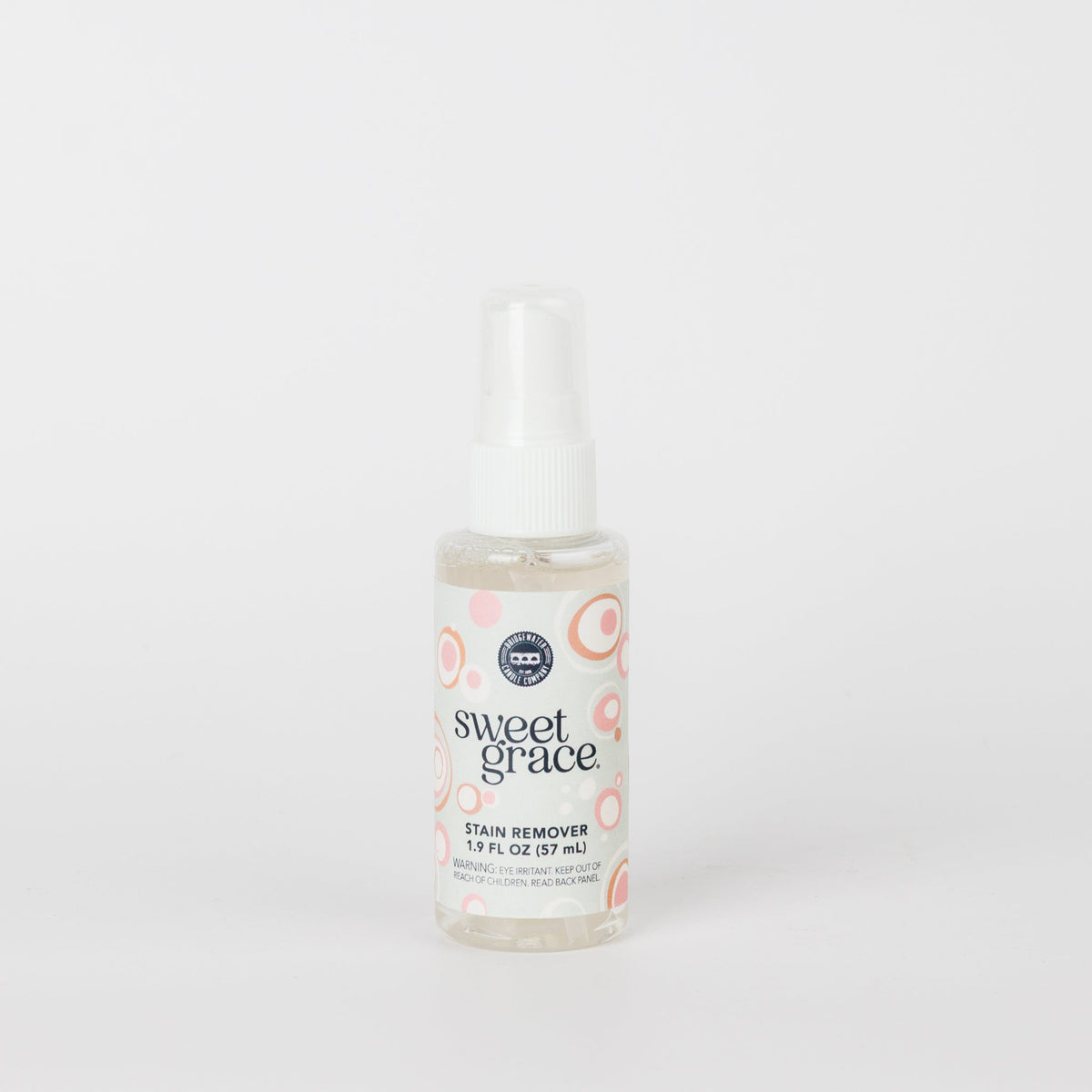Sweet Grace travel-size stain remover spray bottle with pink bubble design on the label.