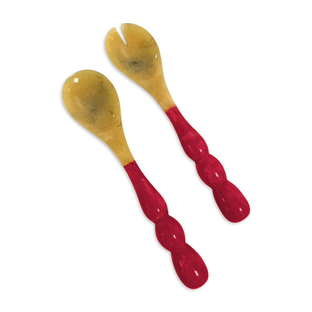 Resin Rio Bubble Salad Servers with translucent horn-like heads and red bubble-shaped handles.