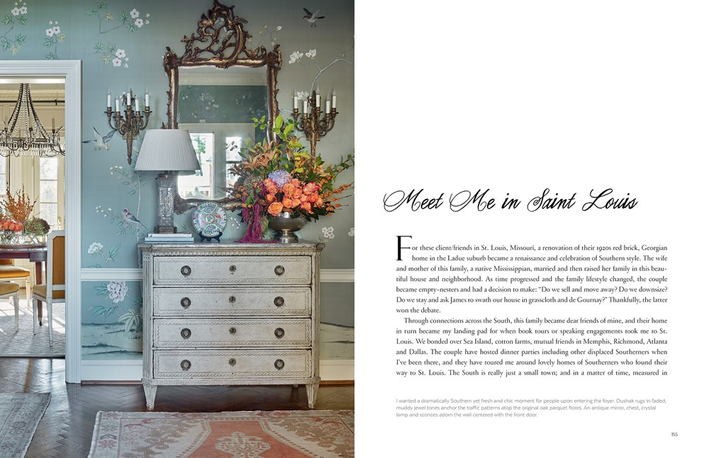 Open book page showing a foyer with floral wallpaper, an antique chest, and a large flower bouquet.