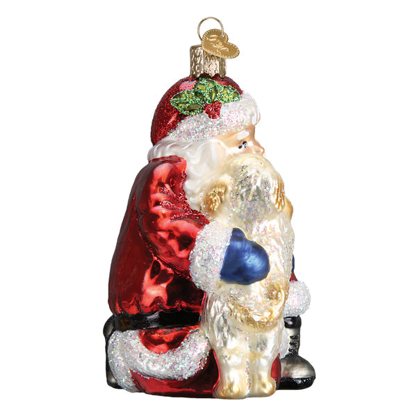 Glass Santa's Puppy Love ornament featuring Santa Claus hugging a golden puppy.