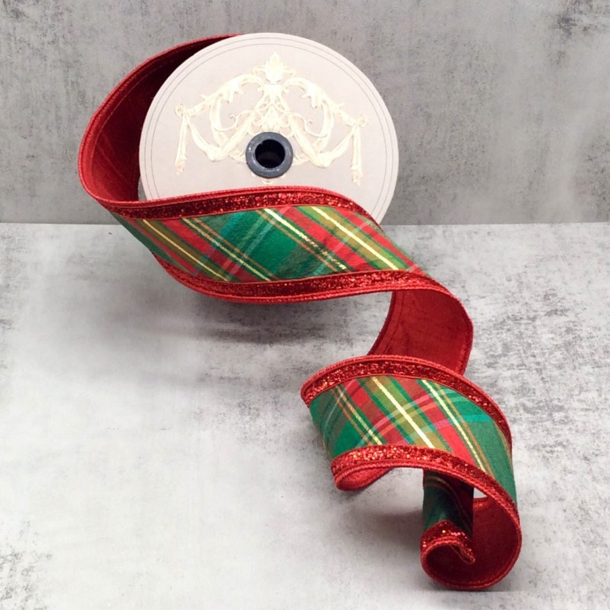 Red dupion silk fabric with diagonal plaid pattern in red, green, and gold threads.