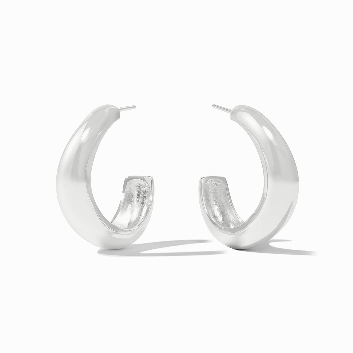 A pair of silver-toned Wave Hoop earrings with a bold, sculptural design and high-polish finish.