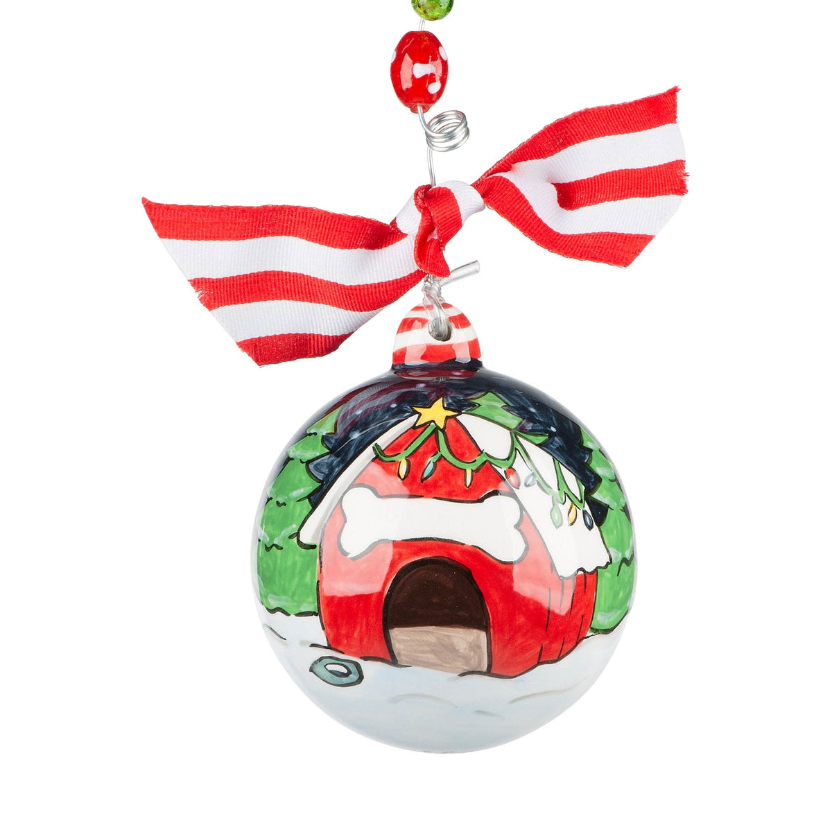 Hand-painted ceramic Christmas dog house ornament with red roof and white walls.