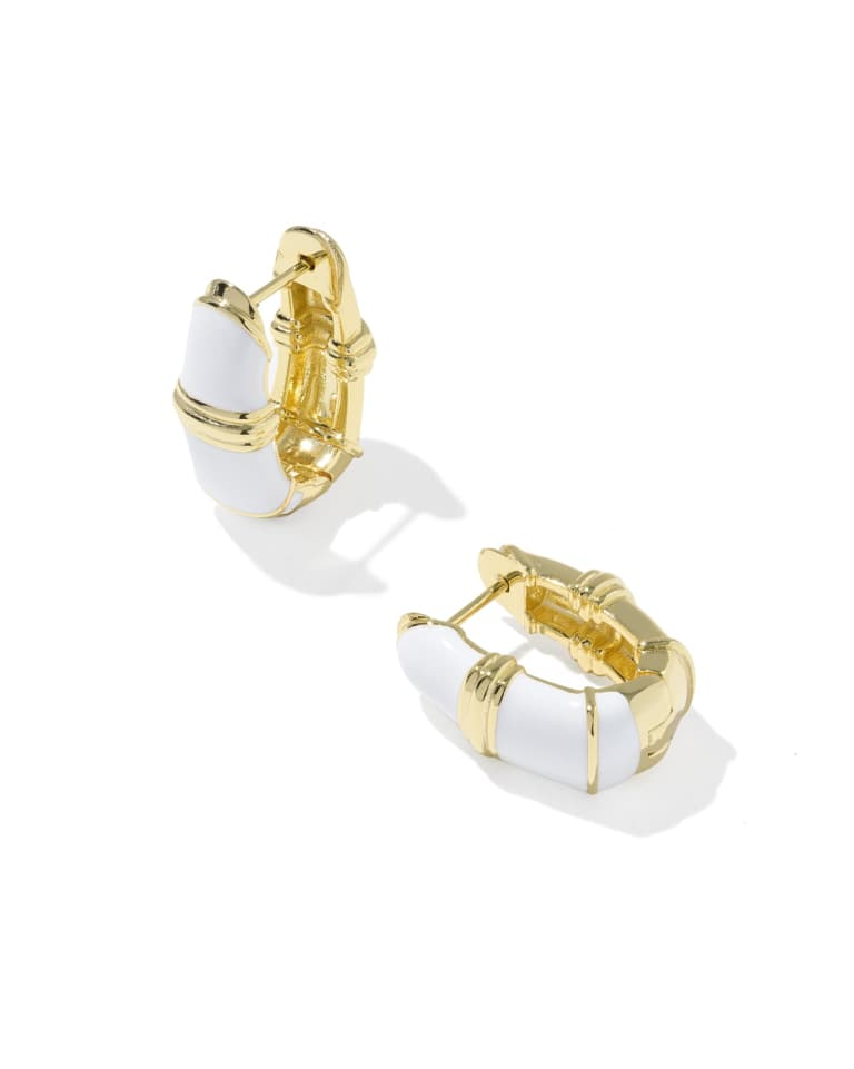 Courtney white enamel and 14k yellow gold over brass huggie earrings with textured metal detailing.