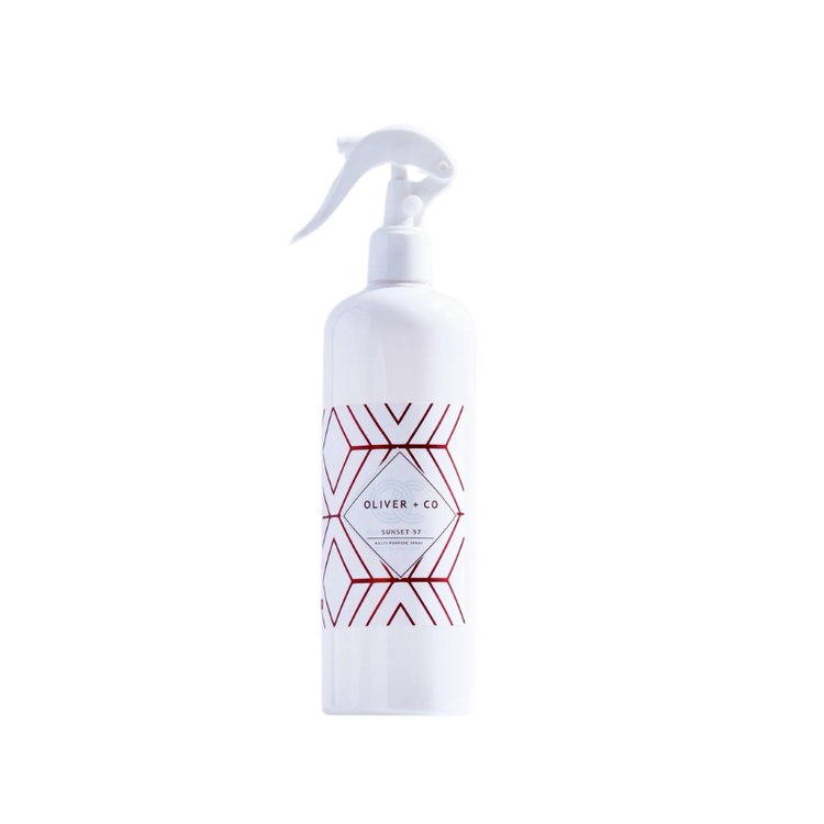 White spray bottle of Oliver + Co Multi-Purpose Cleaner with a red geometric pattern label.