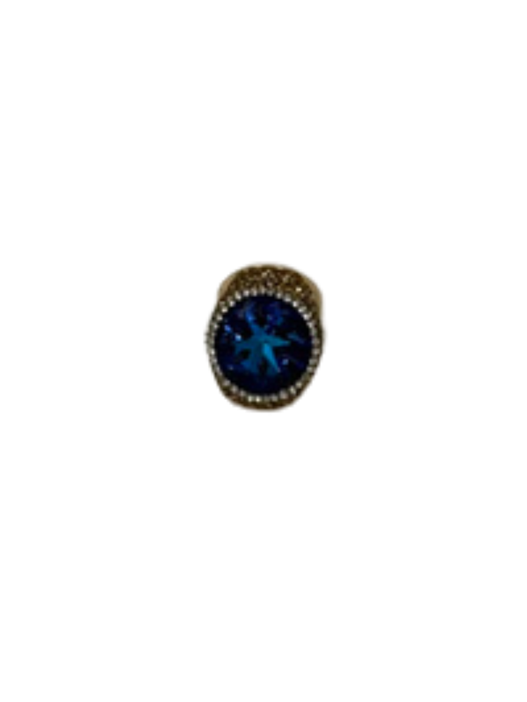 Fashion gemstone ring featuring a large oval blue center stone surrounded by small clear crystals.