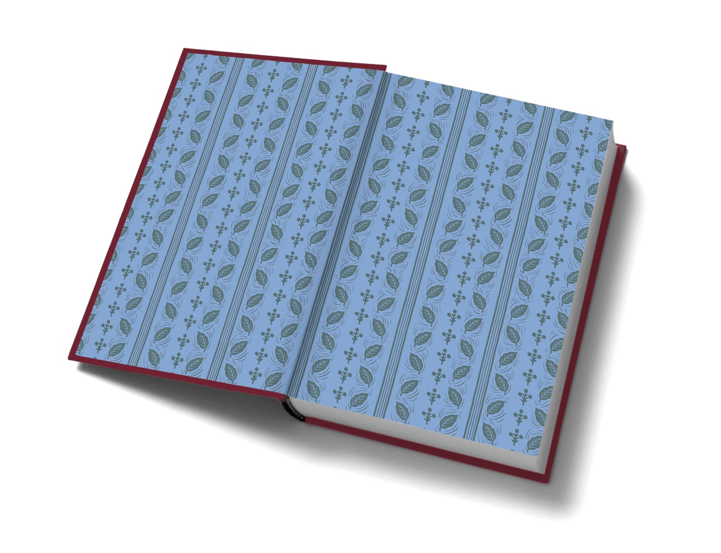 Open copy of Wuthering Heights showing blue endpapers with a repeating leaf and floral pattern.