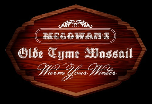 Glass bottle of McGowan's Old Tyme Wassail with a cream-colored label and dark liquid visible.